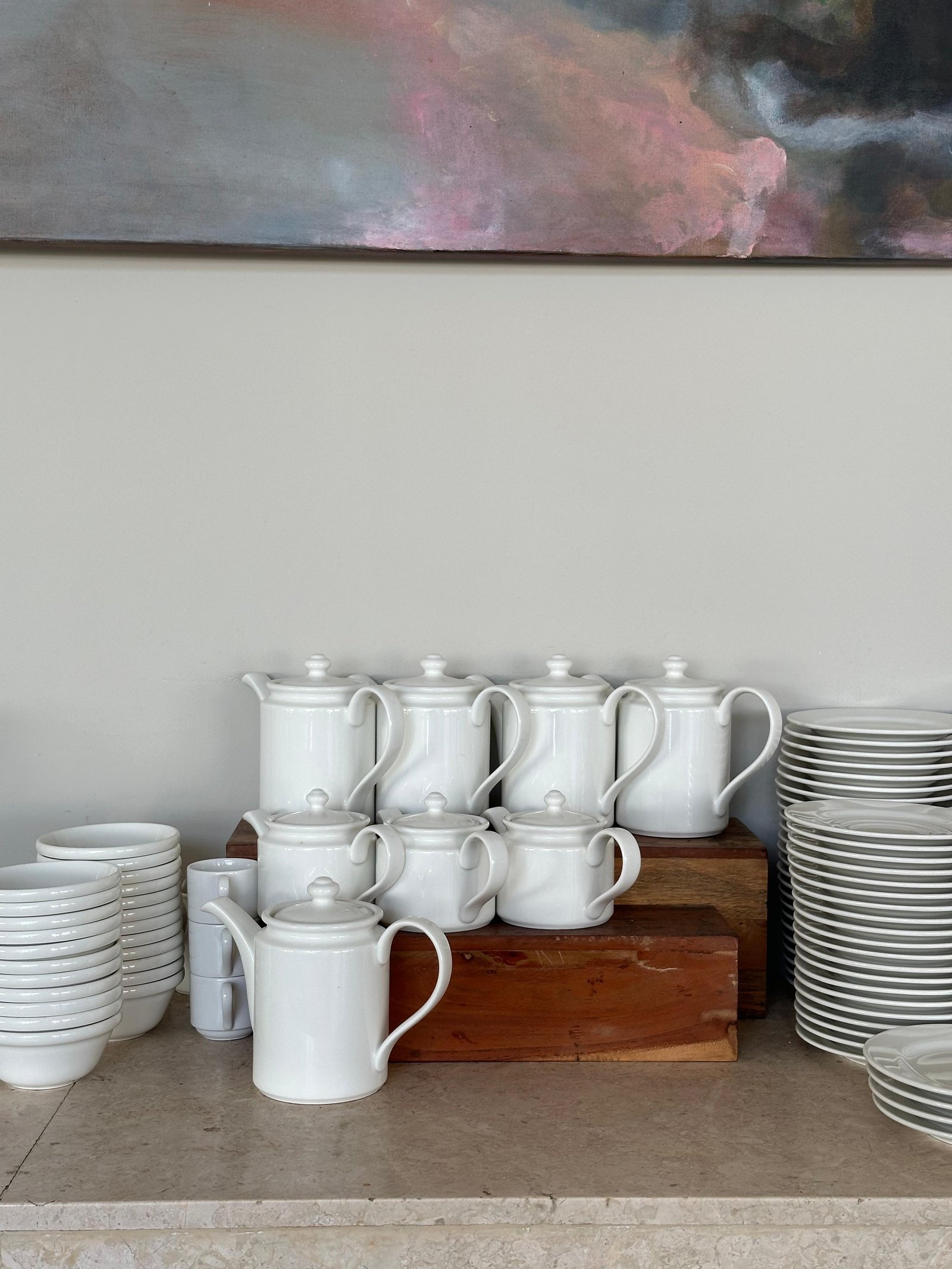 White ceramic teapots and crockery display